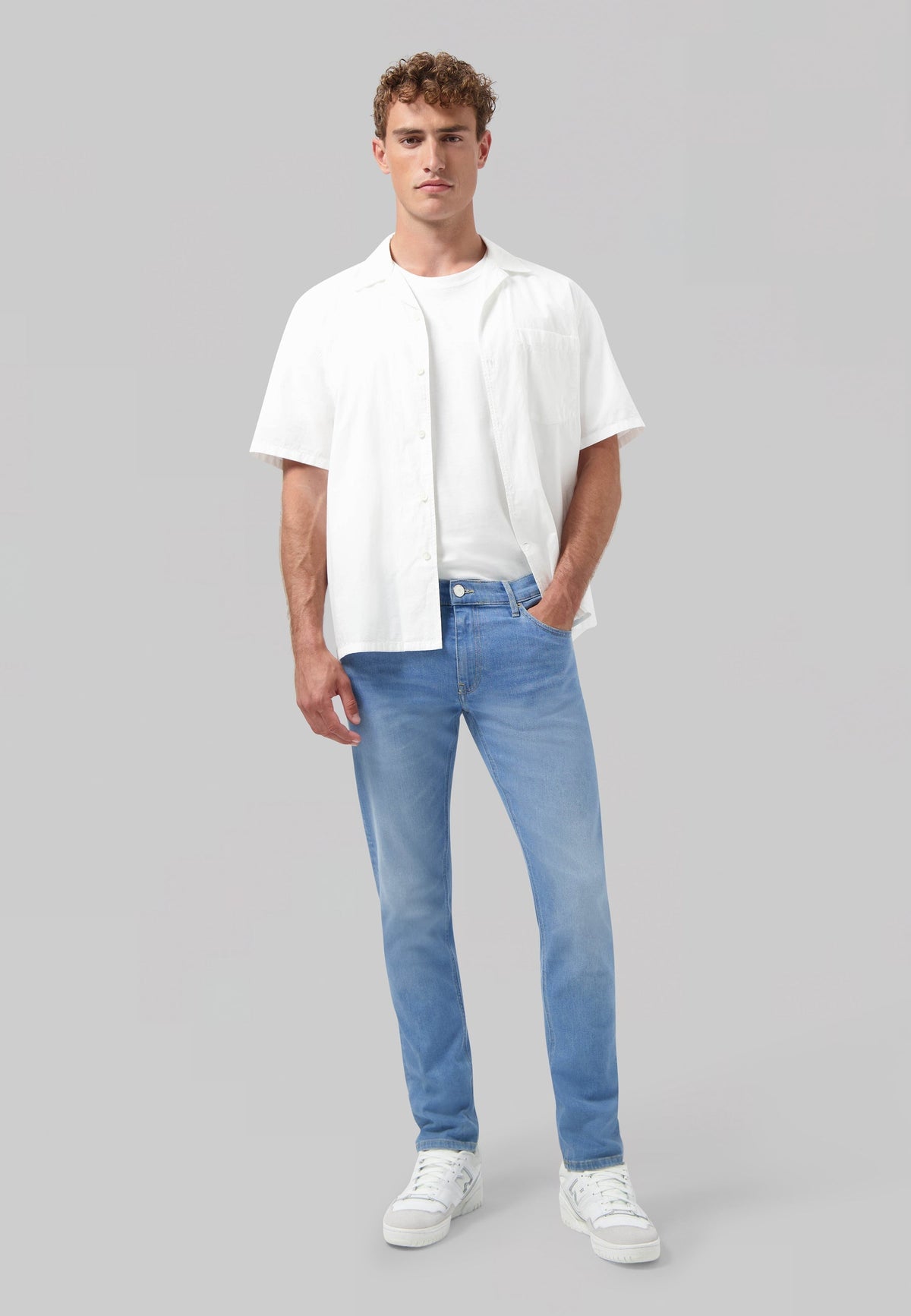 Sustainable MUD Jeans dark blue denim shirt, ethically made, shown from the back, emphasizing classic style.