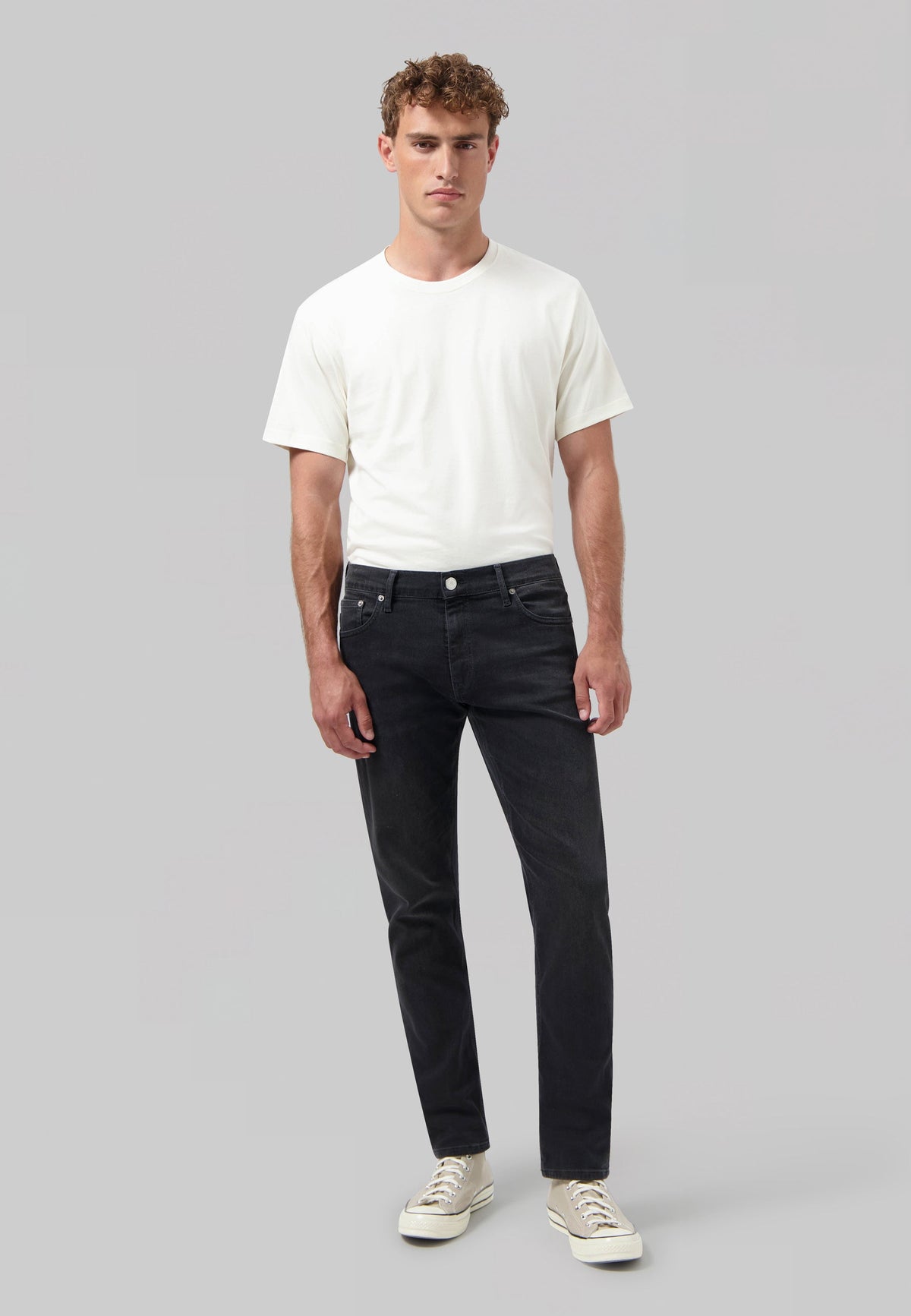 Sustainable MUD Jeans featuring dark denim, highlighting the rear patch logo, crafted for ethical fashion enthusiasts.