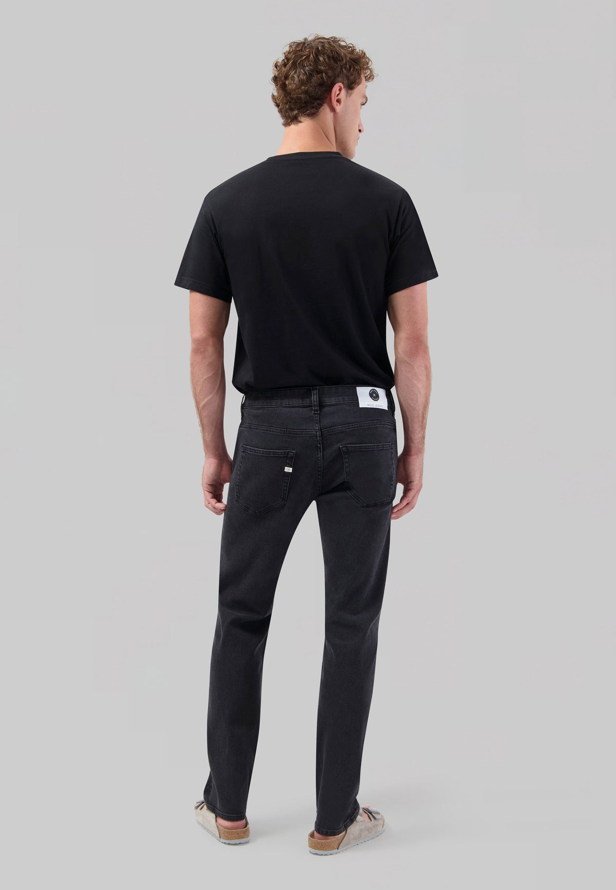 Sustainable MUD Jeans in deep blue denim, featuring a modern slim fit design, ethically crafted for eco-conscious style.