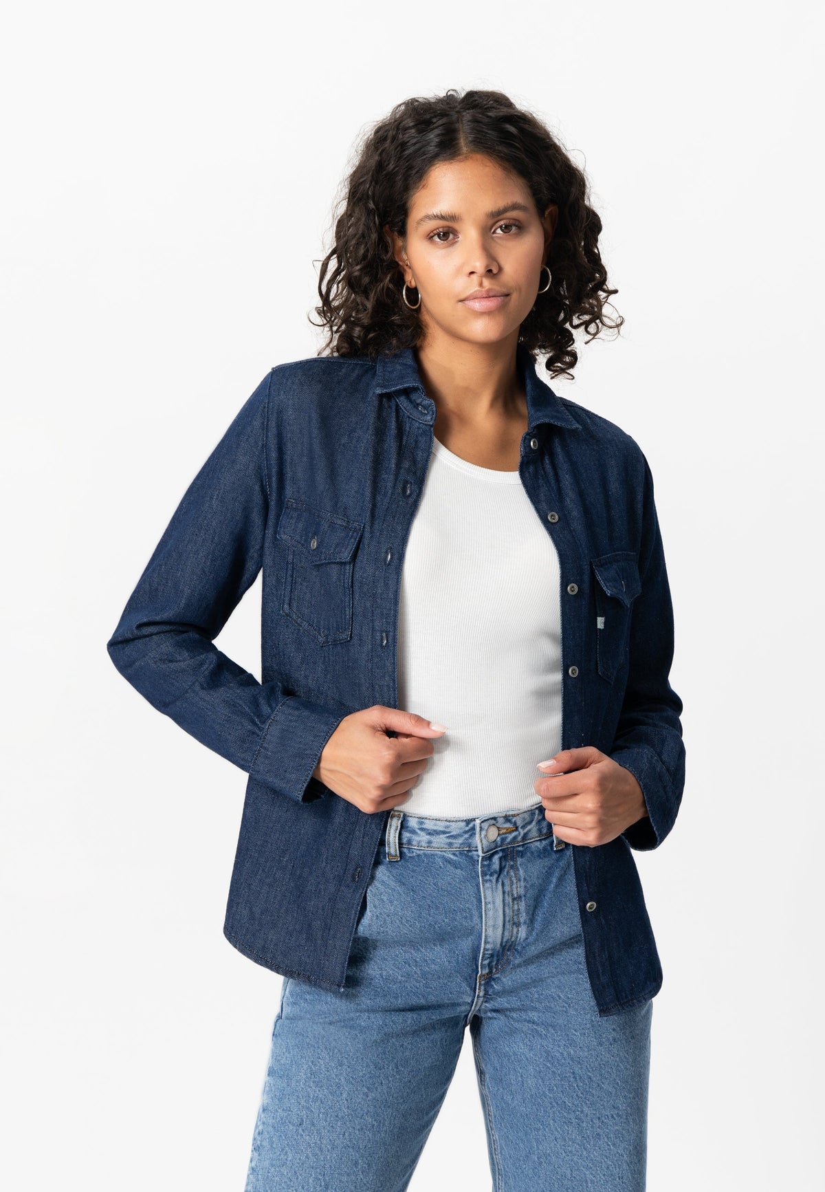Dark denim shirt for women, styled with a white top and light blue jeans, showcasing casual fashion for everyday wear.