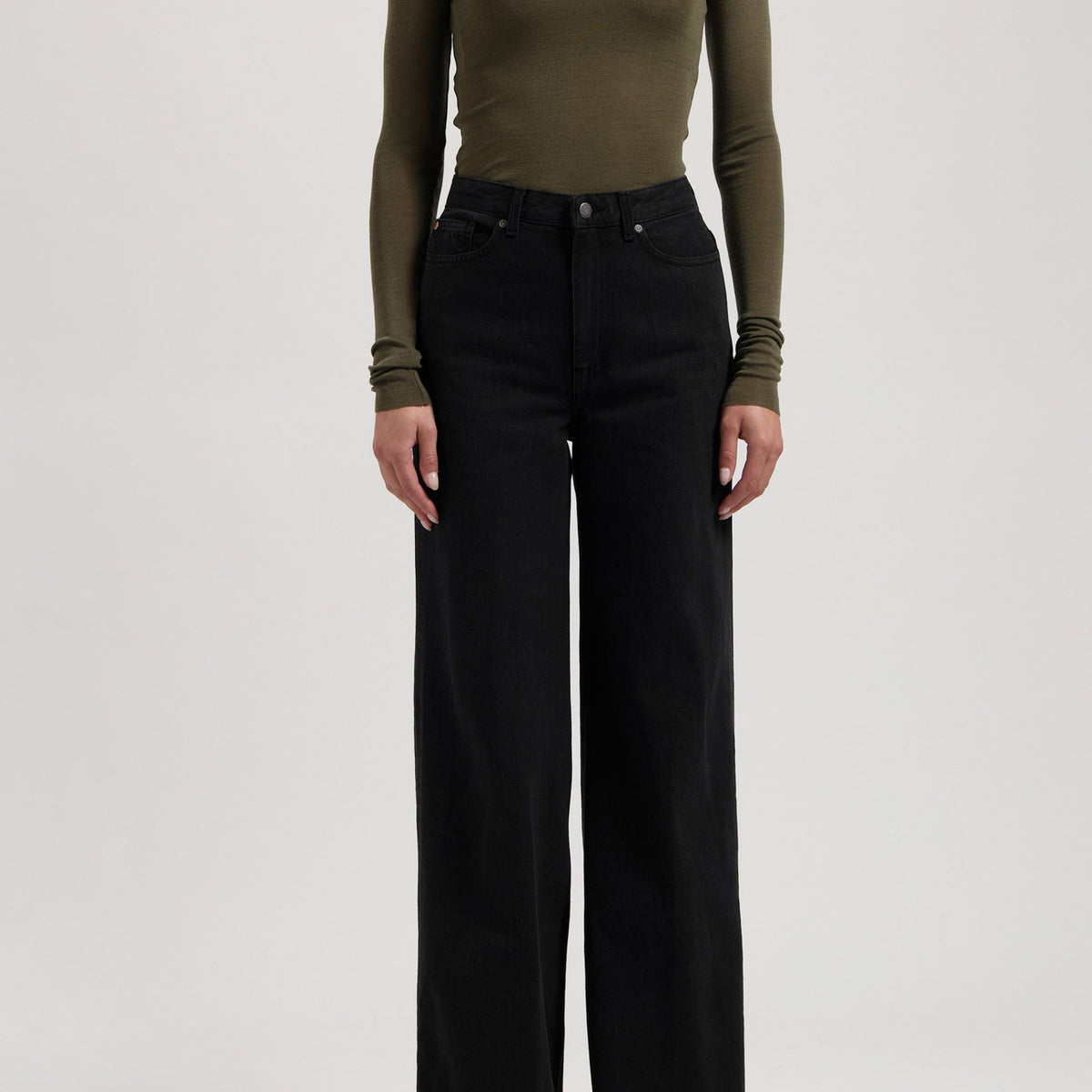 Olive long-sleeve fitted top paired with high-waisted black wide-leg jeans, showcasing casual and chic fashion style.