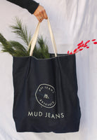 Sustainable MUD Jeans jacket and cargo pants in dark denim, showcasing eco-friendly fashion with ethical design.
