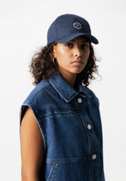 Sustainable Mud Jeans denim jacket in dark blue, featuring ethical design with button-down front and chest pockets.