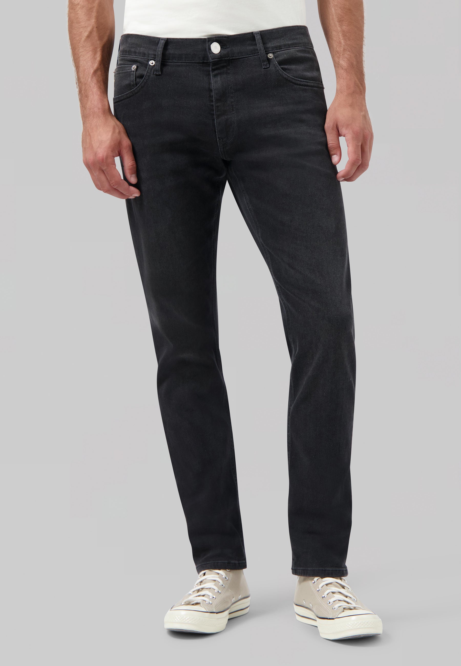 Sustainable MUD Jeans in dark denim, crafted ethically from organic cotton, showcasing a straight leg design for eco-conscious style.