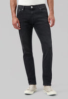 Sustainable MUD Jeans in dark denim, crafted ethically from organic cotton, showcasing a straight leg design for eco-conscious style.