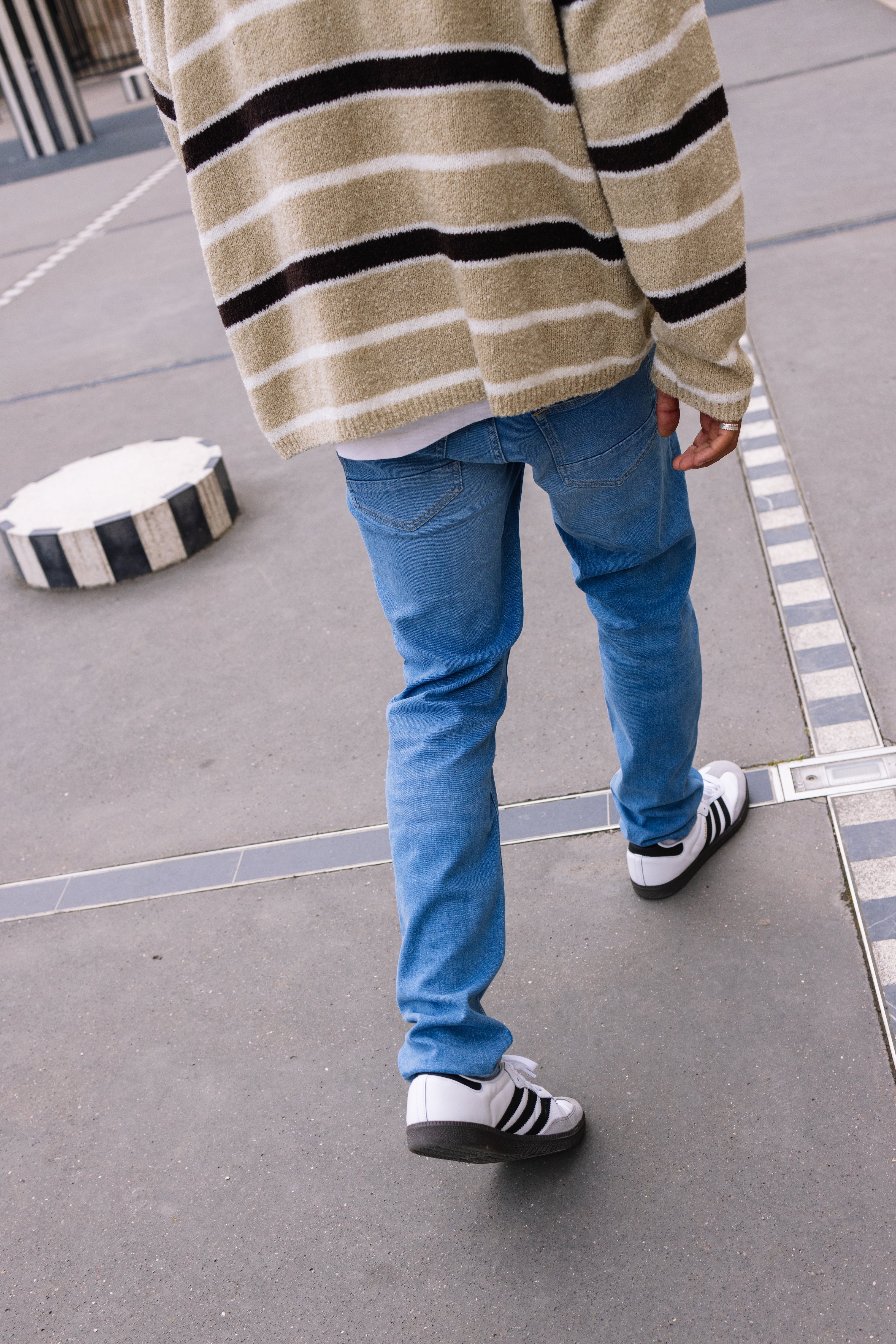 Sustainable MUD Jeans in a dark-gray wash, crafted from organic cotton, showcasing a relaxed fit and ethical design.
