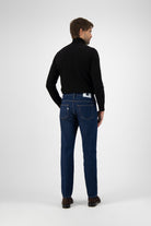 Sustainable MUD Jeans tote bag in dark blue with brand logo, promoting ethical fashion and eco-friendly lifestyle.