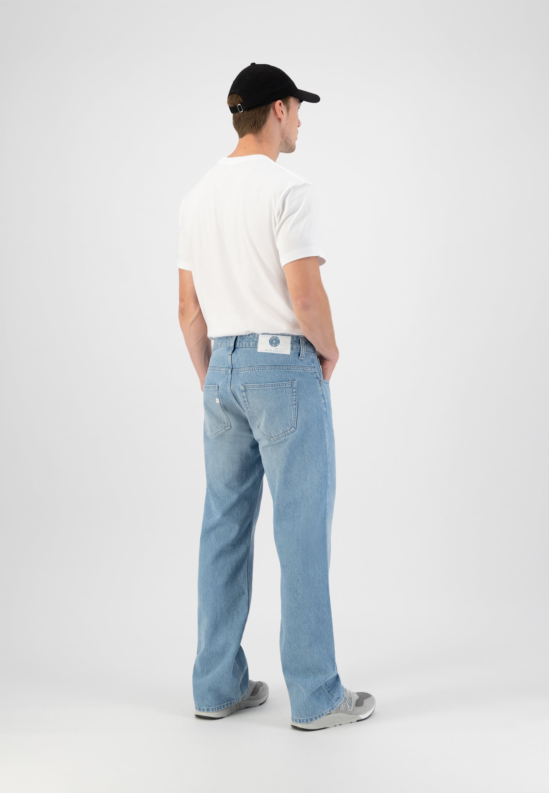 Sustainable MUD Jeans in deep blue denim, ethically made, showcasing a casual fit and classic rear pocket design.