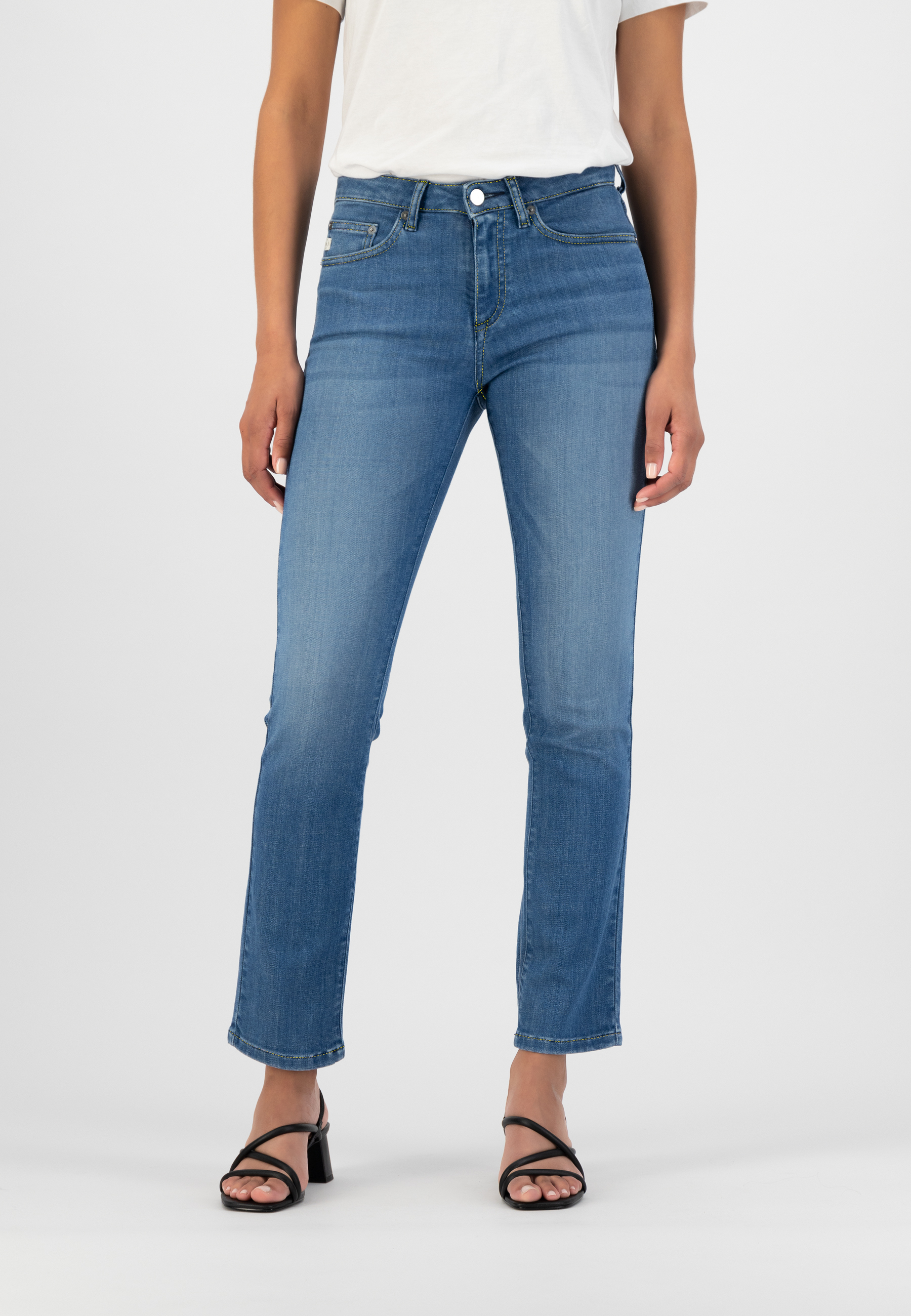 Women's classic blue jeans, mid-rise, straight-leg fit, paired with a plain white tee and black strappy sandals.