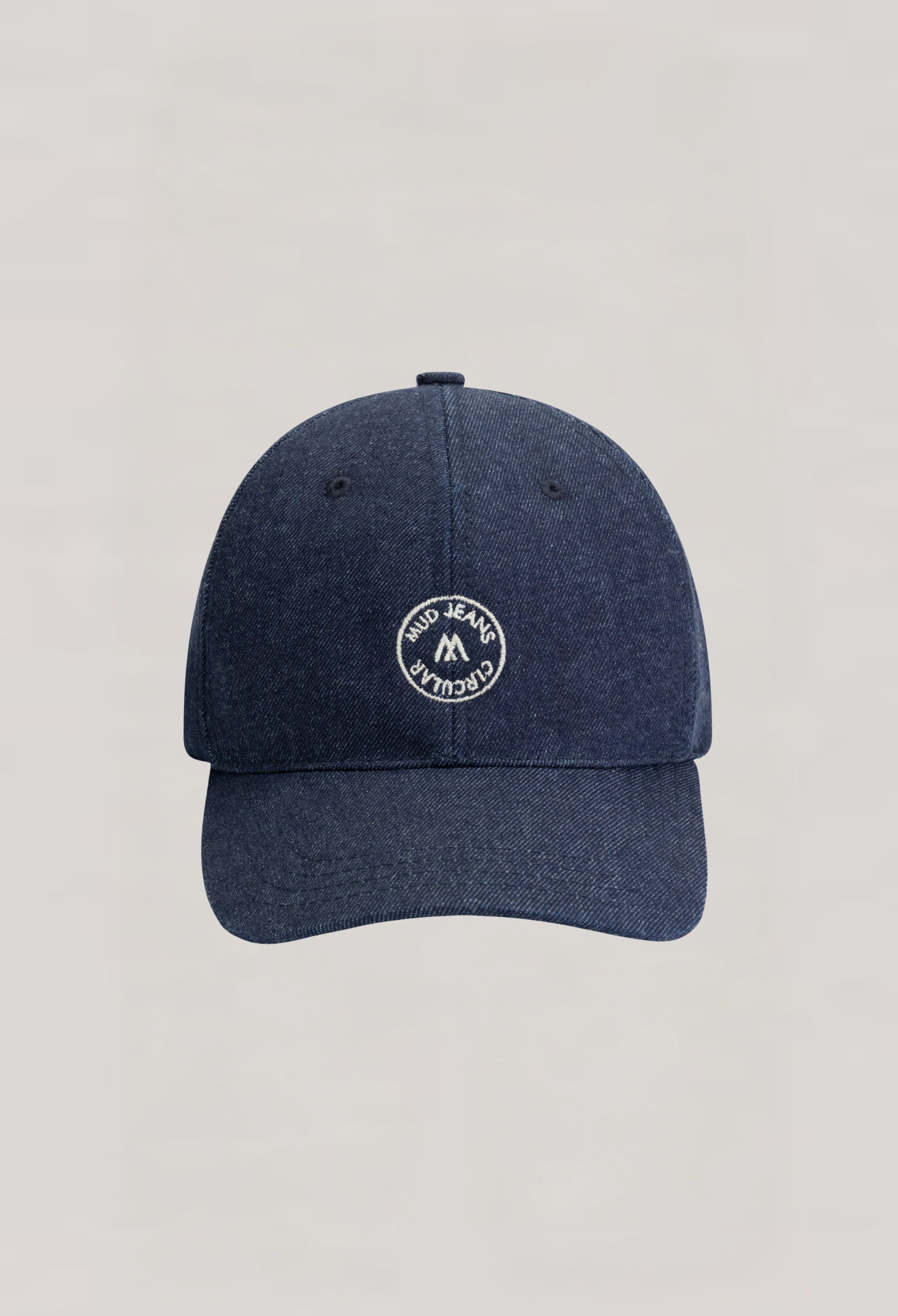 Dark blue denim cap by MUD Jeans featuring a circular patch logo, highlighting sustainable fashion and casual style.