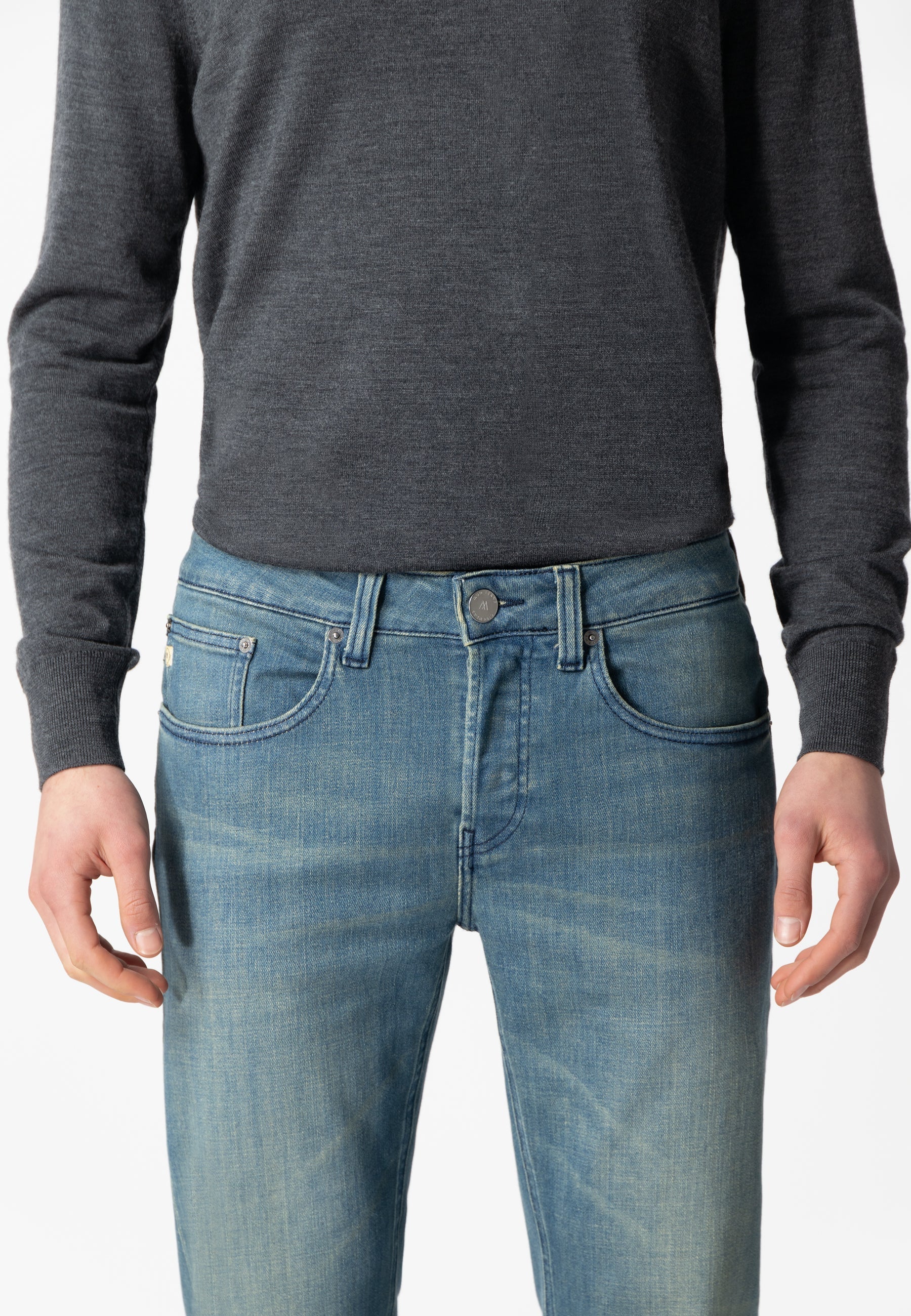 Sustainable Mud Jeans in deep blue denim, crafted from organic cotton for ethical fashion, featuring back pocket detail.