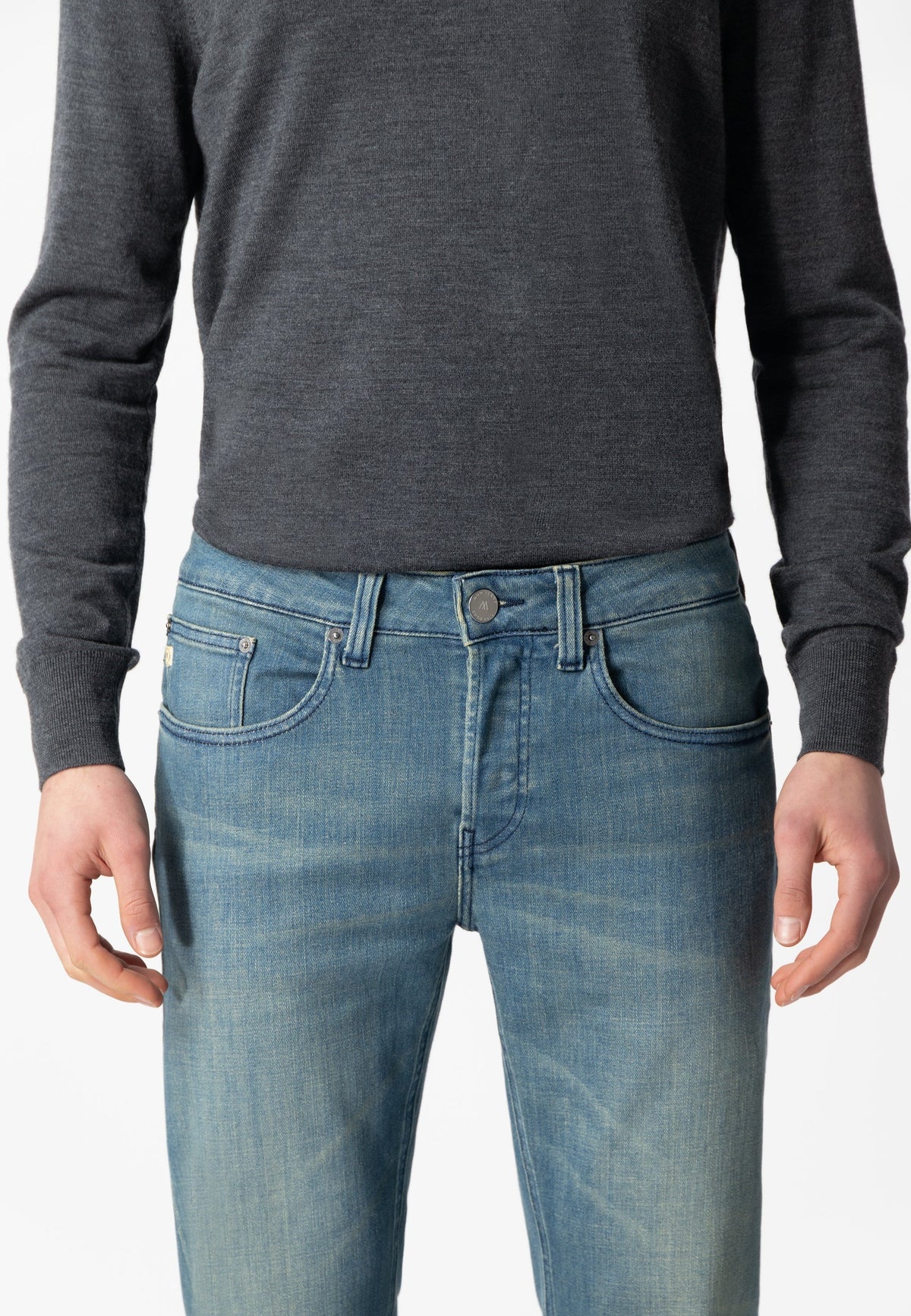 Sustainable Mud Jeans in deep blue denim, crafted from organic cotton for ethical fashion, featuring back pocket detail.